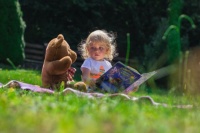 Little Girl with Book And Teddy Bear