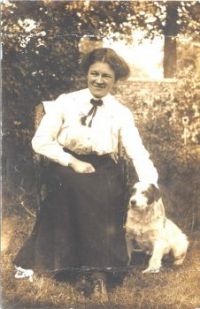 Theme Vintage photos . My mother, c1918. with Judy, family dog, Judy.