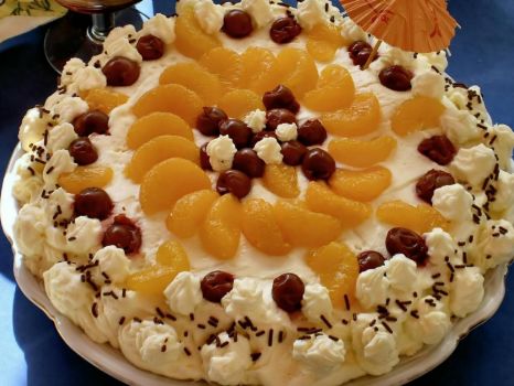 Cream cake with mandarin and cherries  