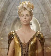 Gold 1: Charlize Theron is mad, bad and covered in glitter