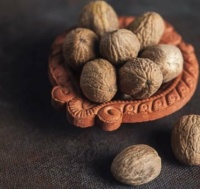 Nutmeg - whole, dried and ready for grating.