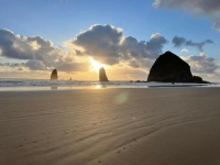 CLOUDY SUNSET OVER HAYSTACK ROCK, OR