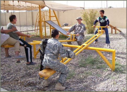 GIs forcing Iraqi kids to see-saw until they talk