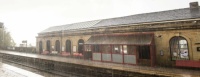 Batley 27-05-2017 station westbound platform in heavy rain horizontal panorama 01