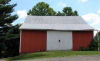 Red barn with white doors
