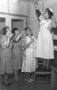 Nurses hanging Christmas decorations