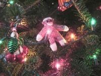 Tiny Sock Monkey celebrates Christmas in July.