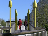 Ladies walking across McLeod bridge at Falls park