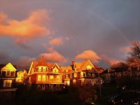 sunset and faint rainbow in Syracuse NY