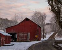 Old red barn on a country road