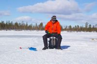 Ice fishing in Swedish Lapland
