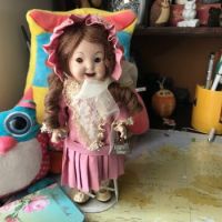 A reproduction, full porcelain  Brigid Google doll.