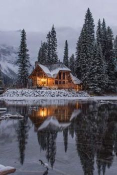 house on lake  winter time    photo