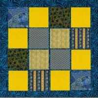 patchwork quilt in blue and yellow