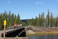 4 wheelers going across the Henrys Fork of the Snake River on the old RailRoad tressel in Island Park, Idaho.