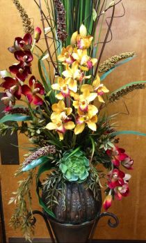 Exotic Orchid Arrangement in a Metal Vase.