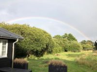 Regenbogen über dem Ferienhaus