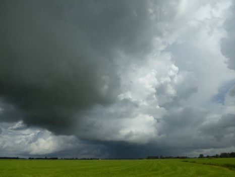 Series Dokkum: The open Frisian countryside, with heavy rainclouds