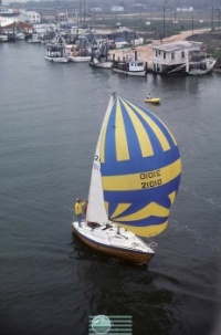 yellow and blue sailboat