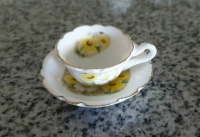 TINY TEA CUP & SAUCER