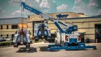 Heavy duty Wrecker lifting two other wrekers_264
