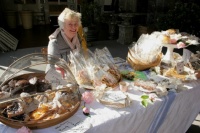 Woman and her cakes at French market