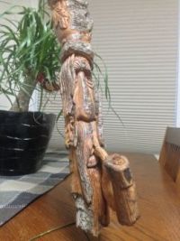 wood spirit with a pipe