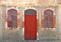 Red door and windows in Portugal, by bricolage.108 