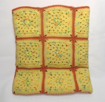 Previous afghan of yellow yarn