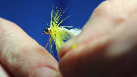 Solve tying a yellow dancer - fly fishing jigsaw puzzle online with 60 ...