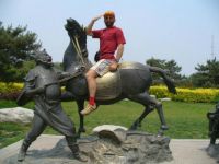 On horseback at the historic Luzhou Bridge in China