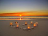Candles on the beach (by CarlyMarie)