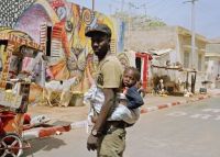 daddy carries baby in Dakar