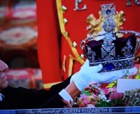 The removal of the Crown the Orb and the Sceptre off the coffin of Queen Elizabeth 11