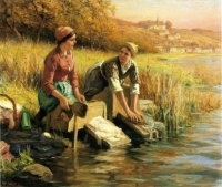 "Women washing clothes by a stream"