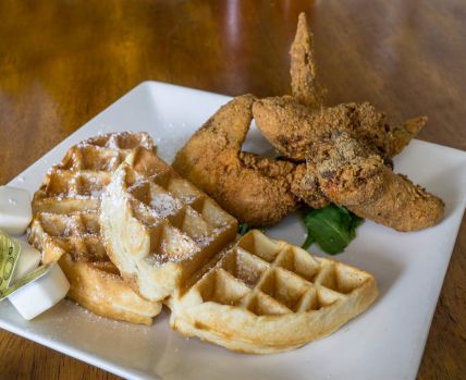 a waffle with hot chicken served at Felix's BBQ with Soul in Oceanside, CA