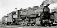 TRRA(Terminal Railroad Association of St. Louis) 0-8-0 #320 simmers waiting to do more yard work in St. Louis, MO. September 17, 1947