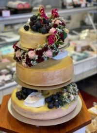 A wedding cake made from whole cheeses.