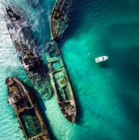 Sunken boats on purpose on Moreton Island in order to create a safe harbor for smaller boats in Queensland, Australia