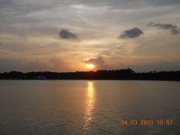 Rat cloud swallowing the setting sun @ Bedok Reservoir Park, Singapore
