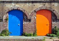Blue and orange doors in Brighton, by George Rex