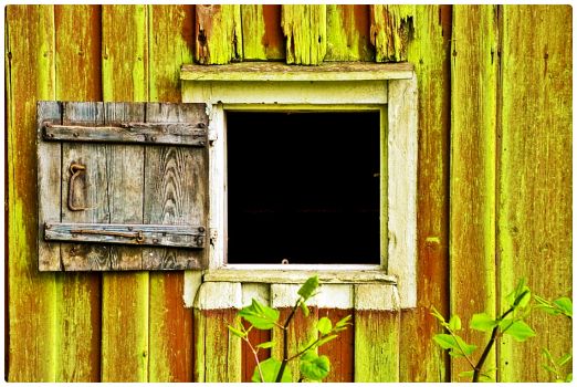 Peek-a-Boo Window in an Old Wooden Wall