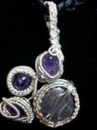 3 amethysts and a ruby zocite pendant