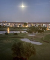 Reflective moon over golfview