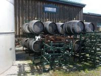 Wine barrels and white cat at Hernder Estate