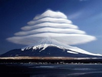 Lenticular Clouds Over Mountain