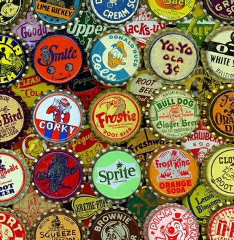 Solve Vintage Bottle Tops jigsaw puzzle online with 64 pieces