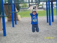 Dominic playing on his old school playground.