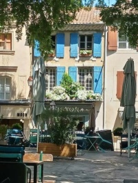 Cute shop with blue shutters