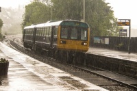 Batley 27-05-2017 Station BR Class 142 031 arriving in heavy rain 02